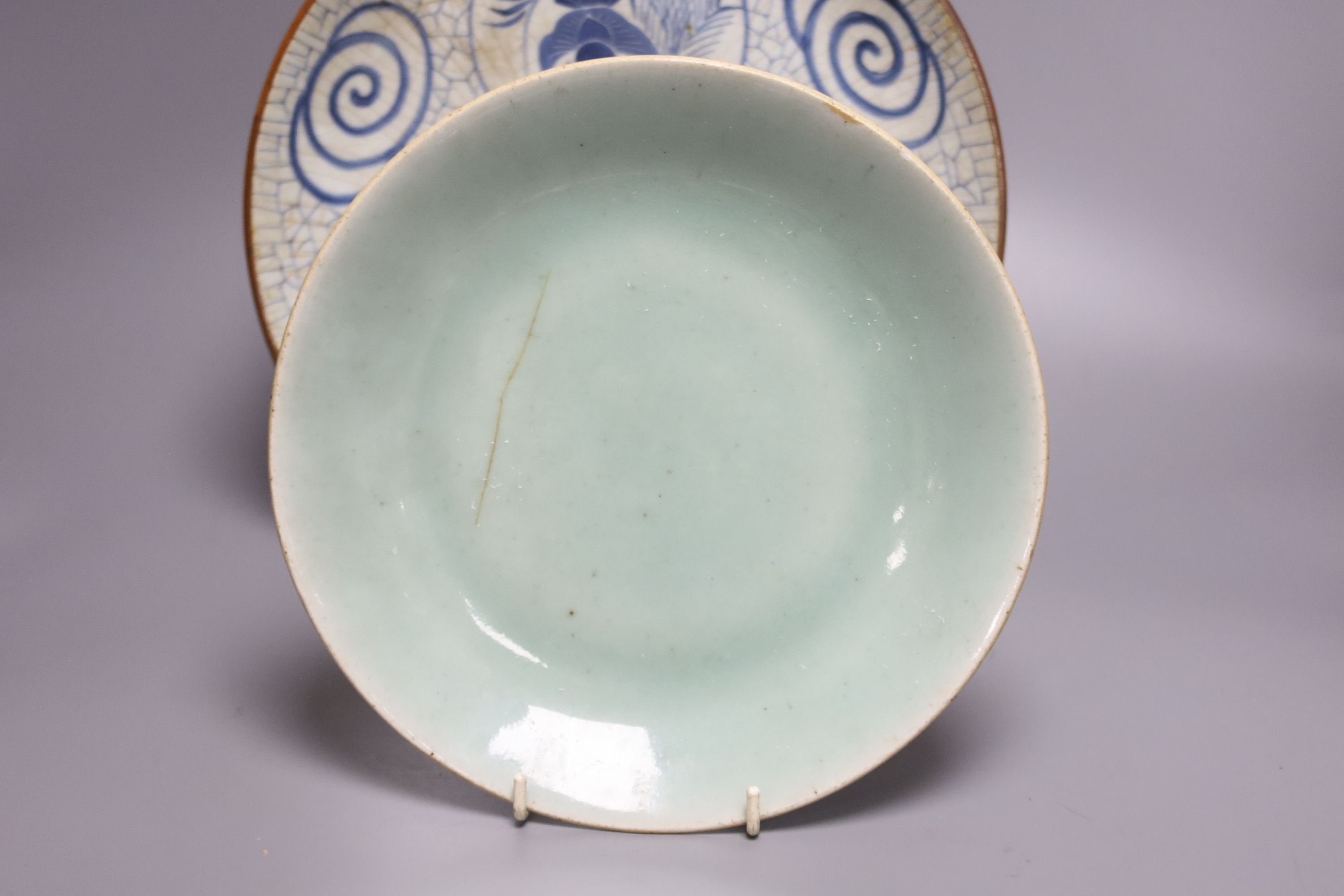 A Japanese crackle glazed dish, another similar and a Chinese celadon glazed dish, largest diameter 29.5cm